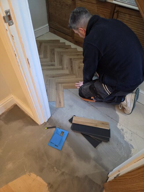 Professional flooring installation in progress